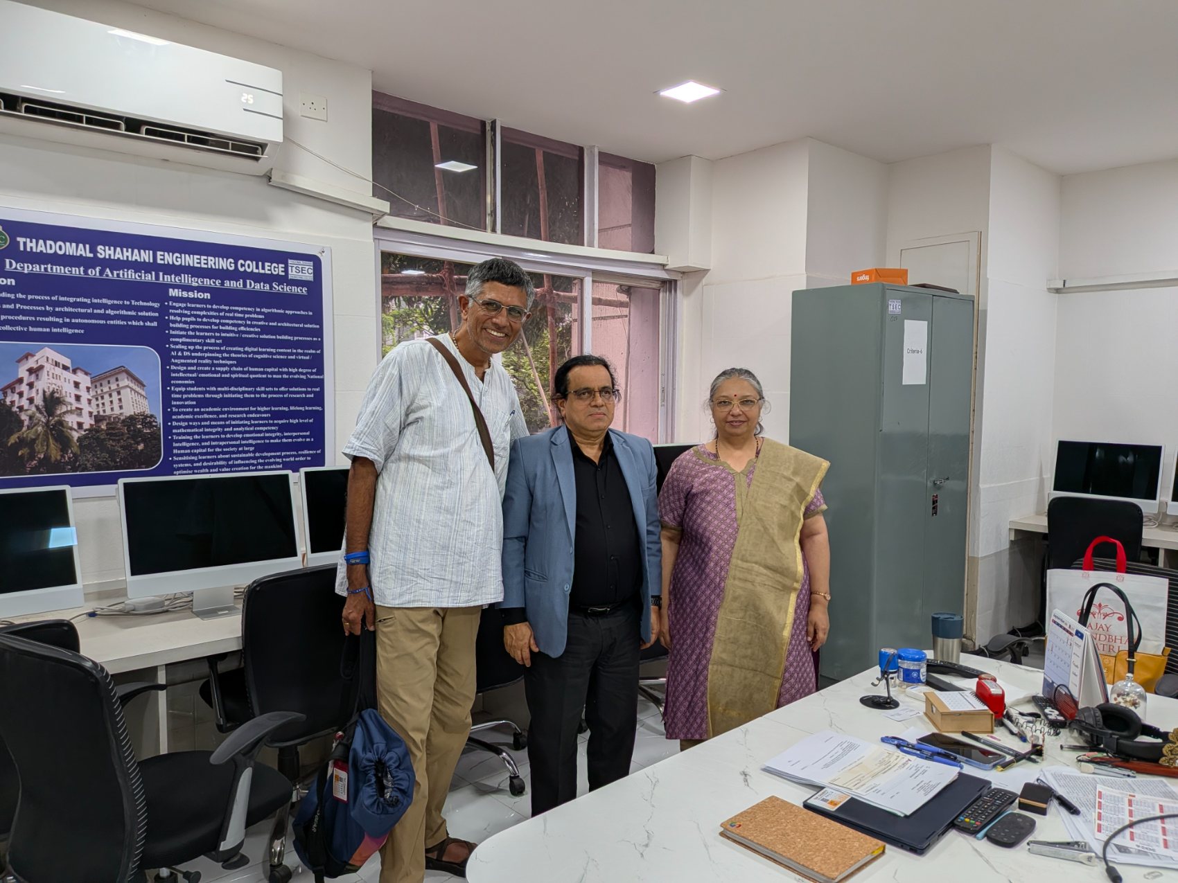 TAP representatives with faculty in front of the TSEC Department of Artificial Intelligence and Data Science vision and mission board